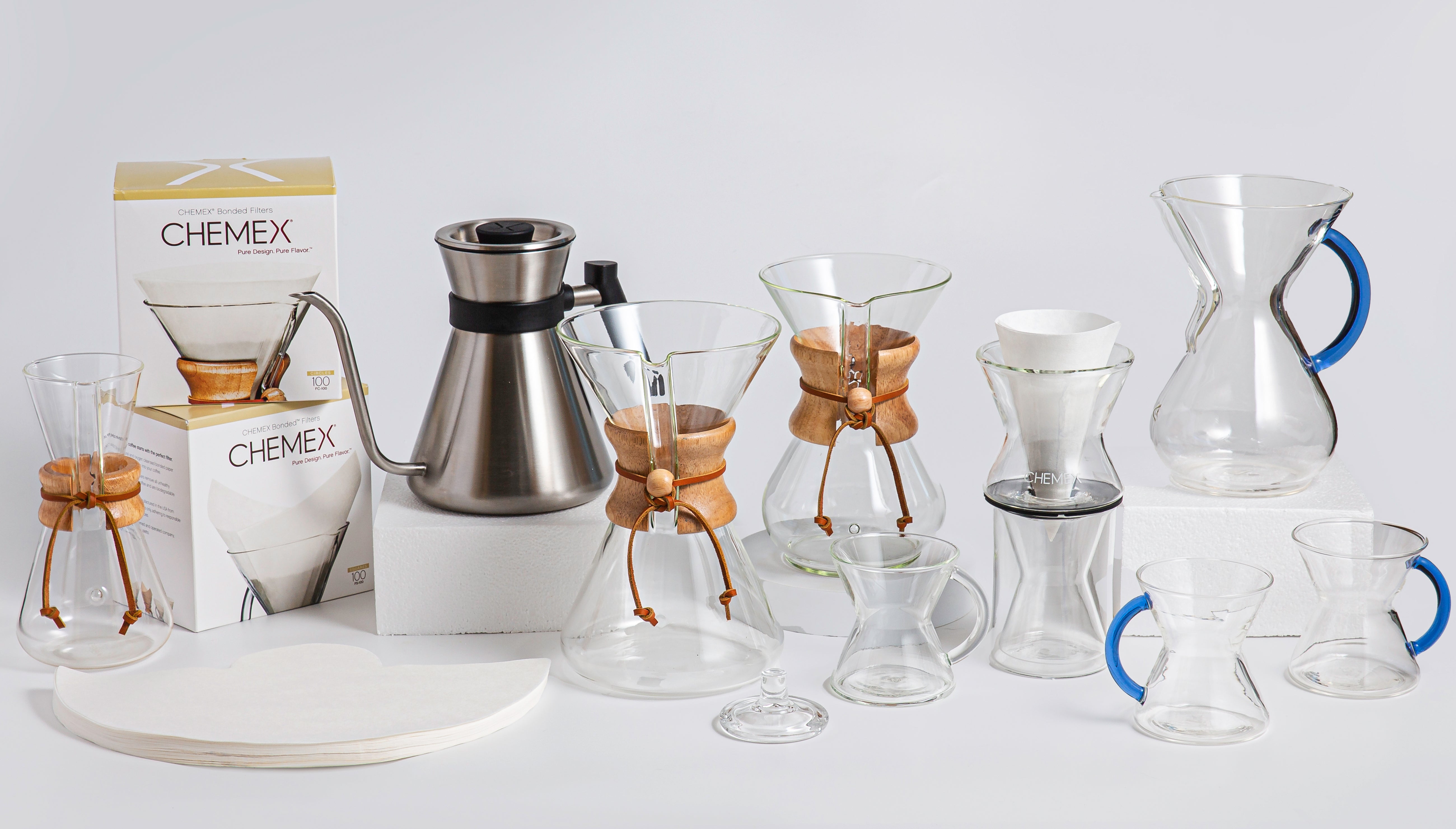 a variety of chemex products lined up next to each against a light background 