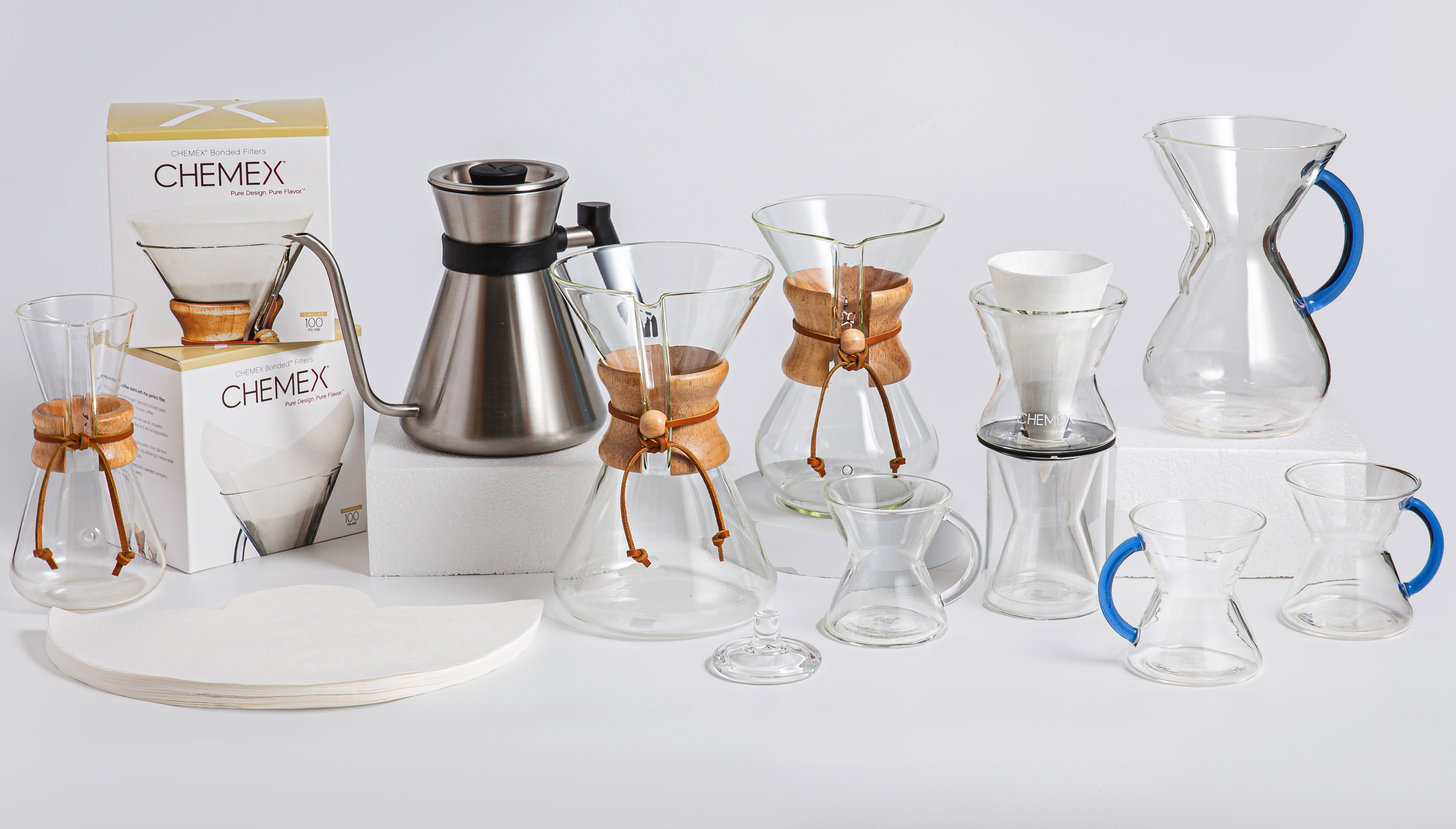 a variety of chemex products lined up next to each against a light background 