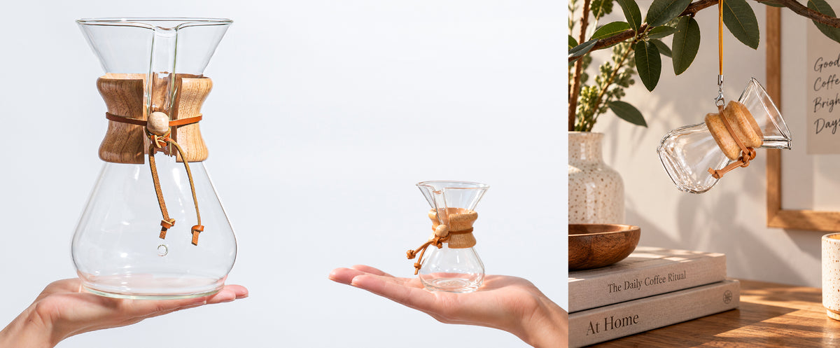 The image on the left shows the full-size 8-cup Classic CHEMEX held in someone’s palm, while the image beside it features the CHEMEX ornament resting in another person’s palm, highlighting the difference in size. The other image to the right shows the CHEMEX ornament hanging from a houseplant, displayed on a wooden table alongside books and greenery.