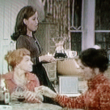 This image appears to be from a television sitcom set in the 1970s, featuring actress Mary Treen serving chemex coffee