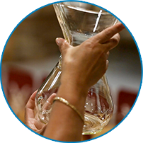 Hands inspecting a Chemex coffeemaker at the Massachusetts factory, 2026